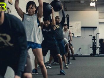 MMA athletes throwing medicine balls.