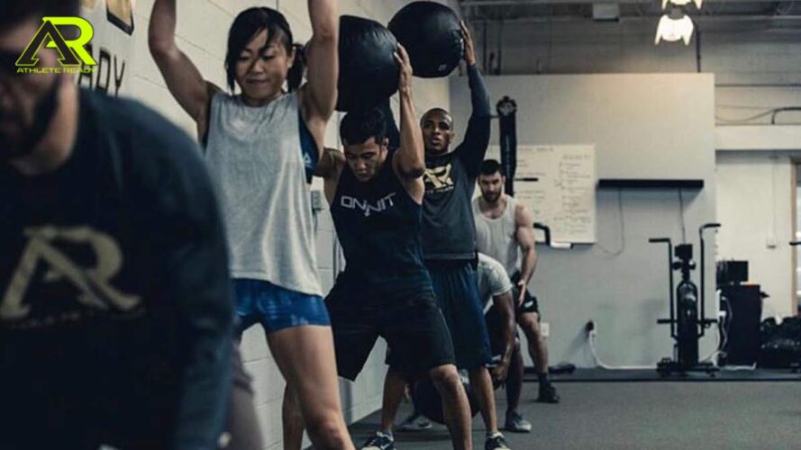 MMA athletes throwing medicine balls.