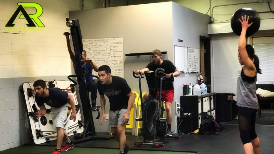 Several athletes working on their sport specific skills and doing various activities.