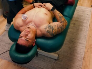 A competitor getting performance therapy at Athlete Ready.