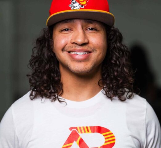 A headshot of Coach Roman