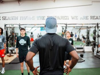 Coach Rob of Athlete Ready giving a fitness class instructions.