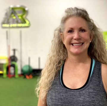 stacy-adult-wellness A woman posing for a picture at Athlete Ready.